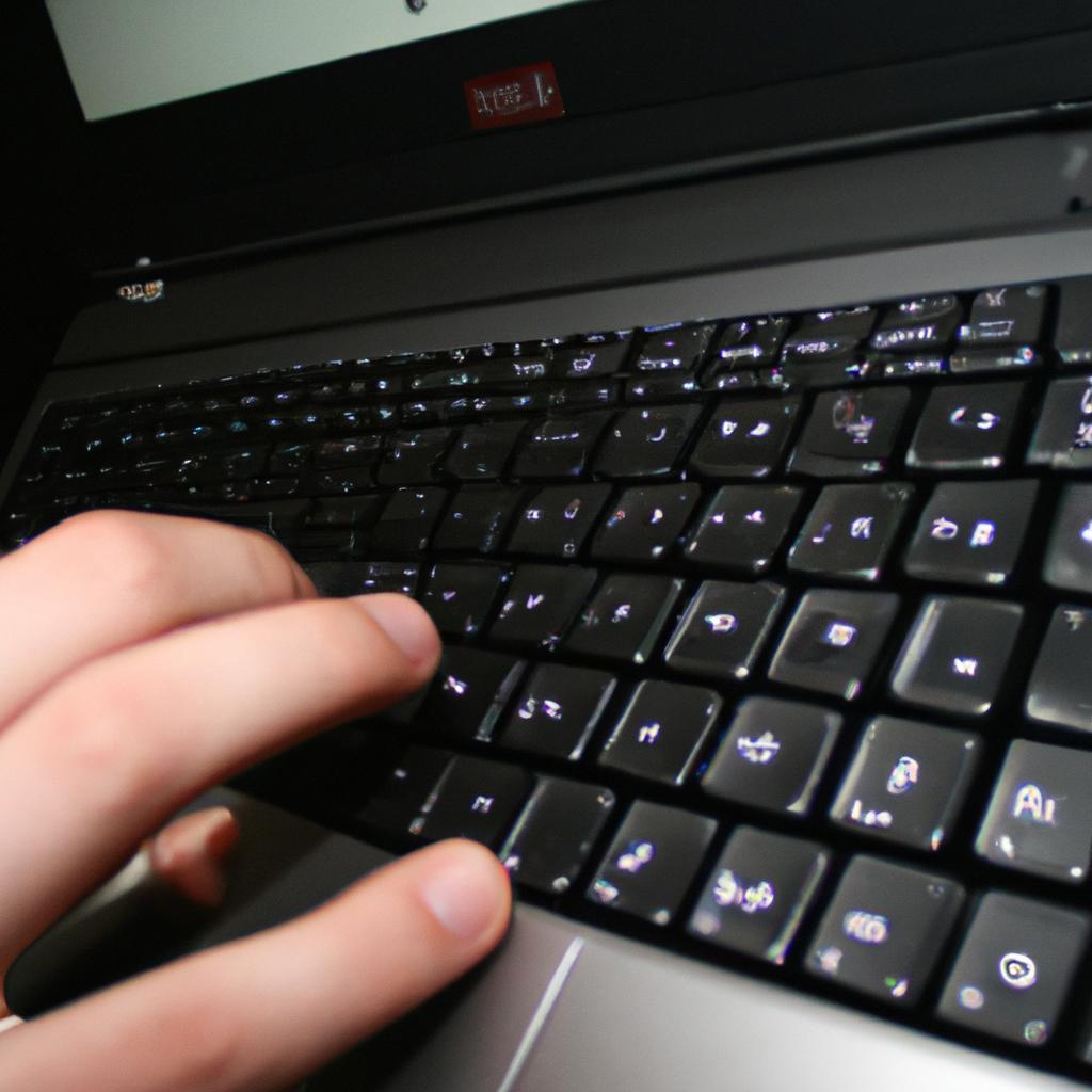 Person typing on laptop, encrypting