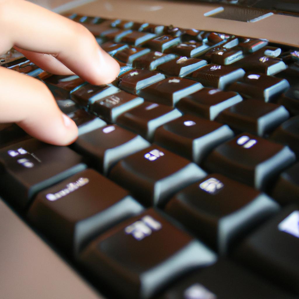 Person typing on computer keyboard